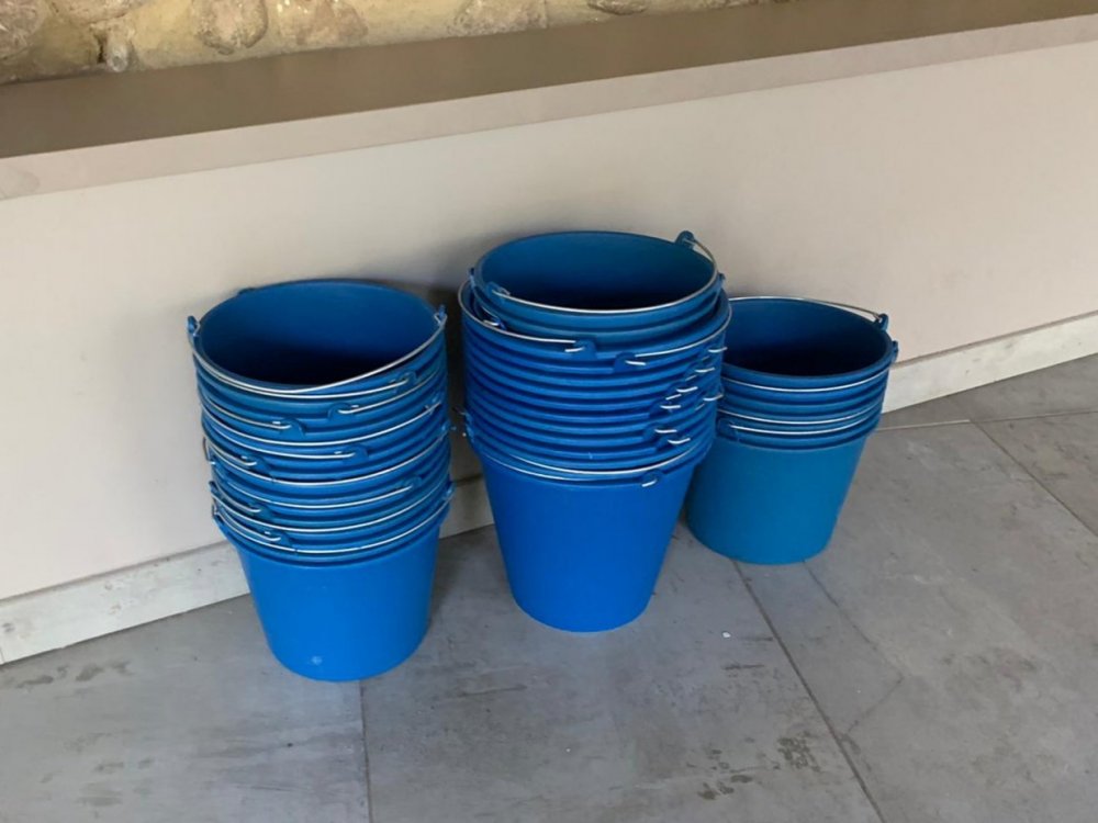 purging buckets prepared for the ayahuasca ceremony at night