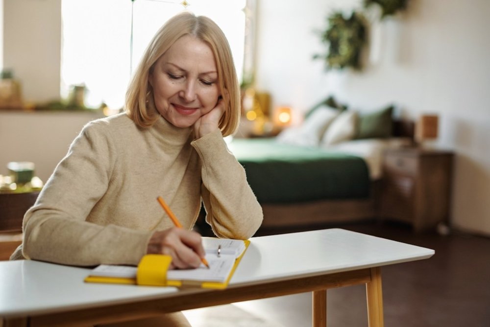 woman-writing-gratitude-journal-happiness.jpg